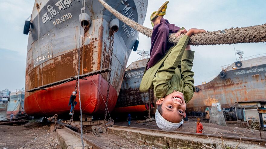 Abbas finds joy in ship ropes by the dockyard.